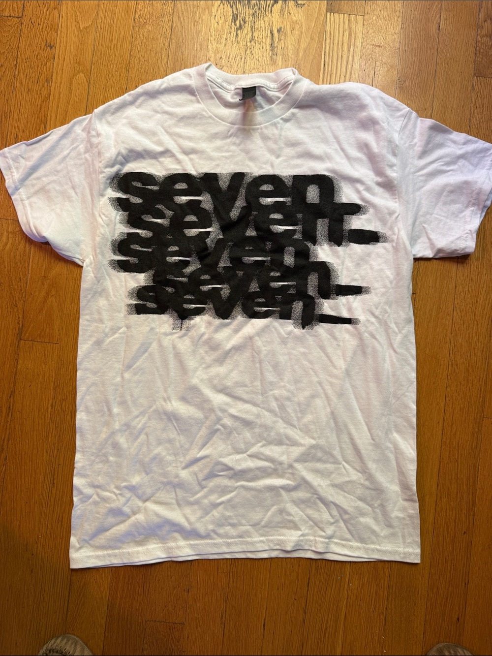 White Short-Sleeve Crewneck Tee with Black Repeated 'seven' Print